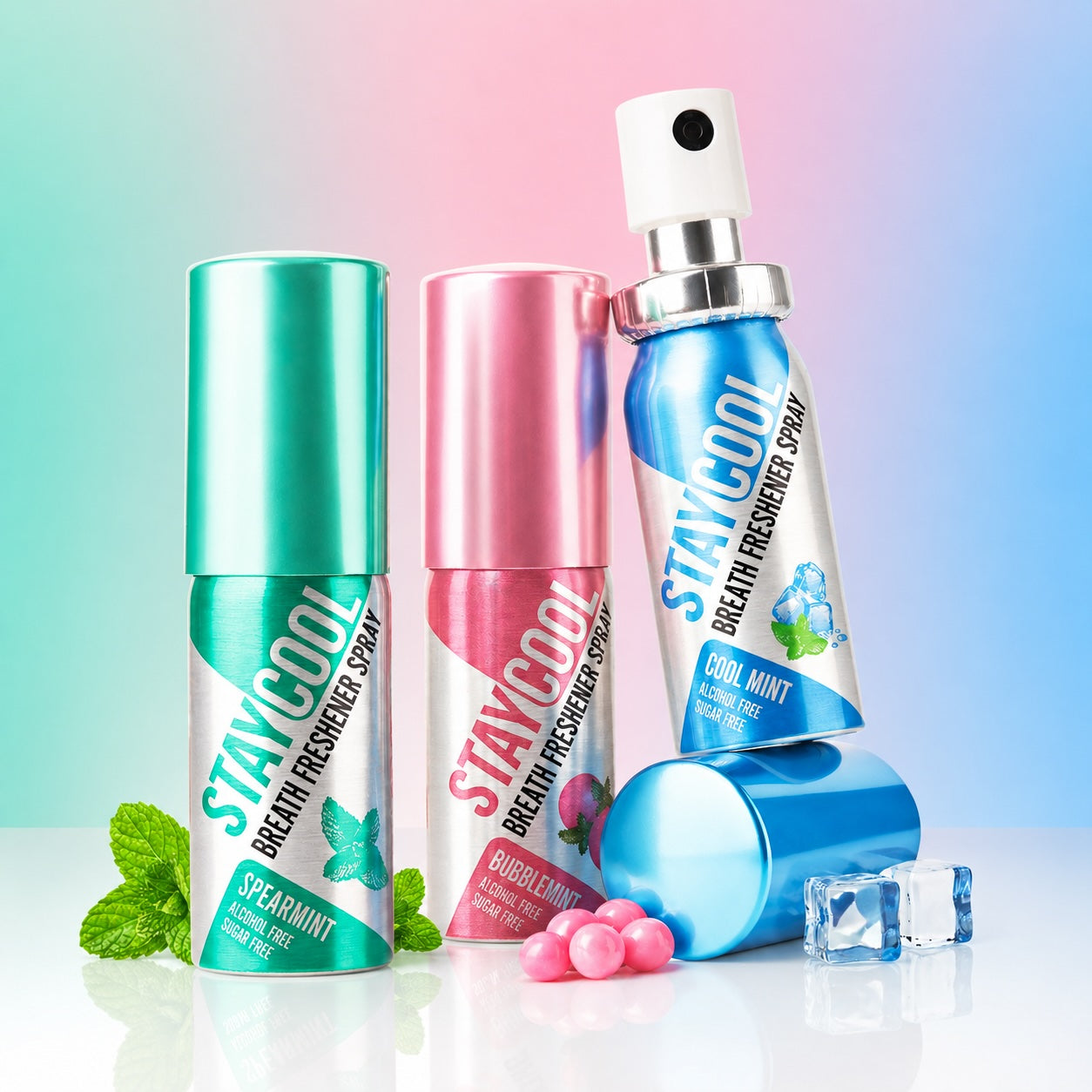 Three STAYCOOL breath freshener sprays with mint leaves, bubble gum, and ice cubes on a light blue background.