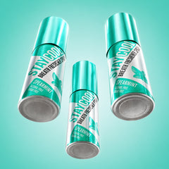 Three cans of Stay Cool breath freshening spearmint flavor sprays on a light blue background